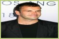 Jonny Lee Miller flashes ink for Ellen charity